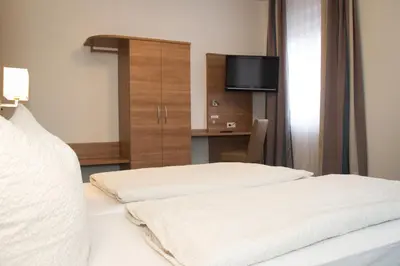 Ein Bett oder Betten in einem Zimmer der Unterkunft Gasthaus zum Ochsen
