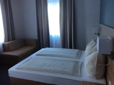 Ein Bett oder Betten in einem Zimmer der Unterkunft Gasthaus zum Ochsen