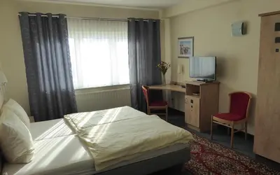 Ein Bett oder Betten in einem Zimmer der Unterkunft Hotel Ring Park