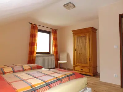 Ein Bett oder Betten in einem Zimmer der Unterkunft Feriendomizil am Rheinbogen