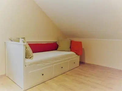 Ein Bett oder Betten in einem Zimmer der Unterkunft Feriendomizil am Rheinbogen