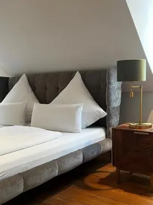Ein Bett oder Betten in einem Zimmer der Unterkunft Hofgut Holzmuhle