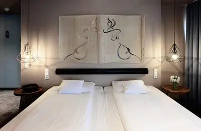 Ein Bett oder Betten in einem Zimmer der Unterkunft Seehotel Niedernberg - Das Dorf am See