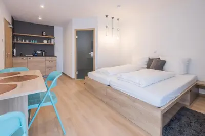 Ein Bett oder Betten in einem Zimmer der Unterkunft Pension Breitenauer See