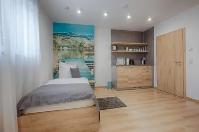 Ein Bett oder Betten in einem Zimmer der Unterkunft Pension Breitenauer See