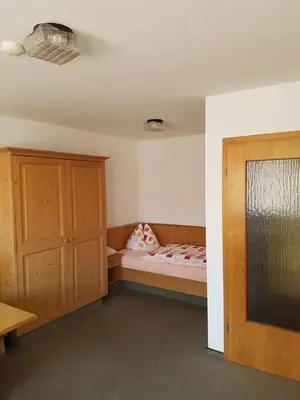 Ein Bett oder Betten in einem Zimmer der Unterkunft Gästehaus Kübler