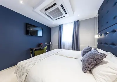 Ein Bett oder Betten in einem Zimmer der Unterkunft Hotel Tommasi