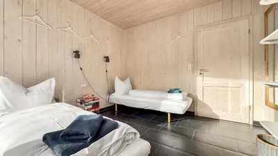 Ein Bett oder Betten in einem Zimmer der Unterkunft Schwarzwaldstrand Ferienwohnungen