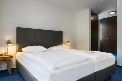 Ein Bett oder Betten in einem Zimmer der Unterkunft Hotel Strohgäu