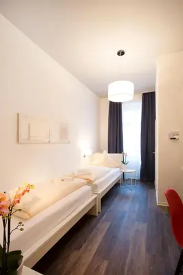 Ein Bett oder Betten in einem Zimmer der Unterkunft Hotel Mille Stelle City