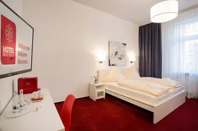 Ein Bett oder Betten in einem Zimmer der Unterkunft Hotel Mille Stelle City