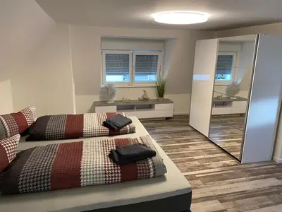 Ein Bett oder Betten in einem Zimmer der Unterkunft Ermmes Ferienwohnungen