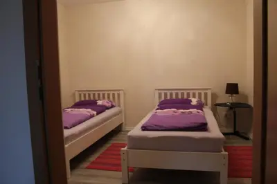 Ein Bett oder Betten in einem Zimmer der Unterkunft Ferienwohnung - Monteurwohnung Familie Houri