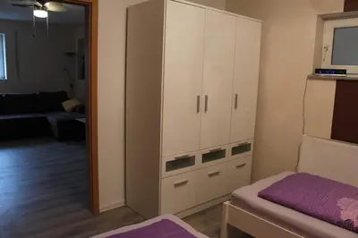 Ein Bett oder Betten in einem Zimmer der Unterkunft Ferienwohnung - Monteurwohnung Familie Houri