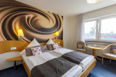 Ein Bett oder Betten in einem Zimmer der Unterkunft Hotel Rheingold