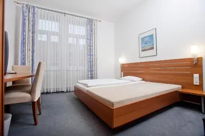 Ein Bett oder Betten in einem Zimmer der Unterkunft Hotel Grünshof
