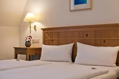 Ein Bett oder Betten in einem Zimmer der Unterkunft Hotel Grünshof