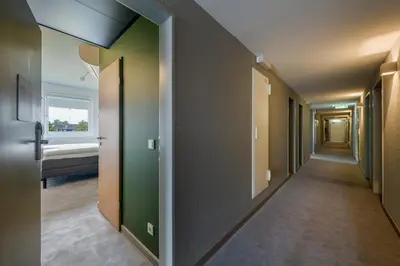 Ein Bett oder Betten in einem Zimmer der Unterkunft Felix Hotel Darmstadt