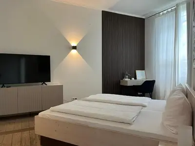 Ein Bett oder Betten in einem Zimmer der Unterkunft Hotel Hahn Gondelsheim