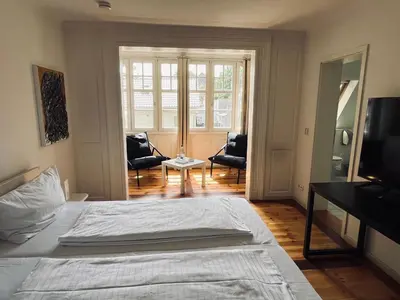 Ein Bett oder Betten in einem Zimmer der Unterkunft Hotel Hahn Gondelsheim