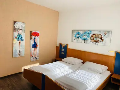 Ein Bett oder Betten in einem Zimmer der Unterkunft Hotel Europa - Restaurant