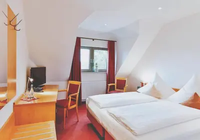 Ein Bett oder Betten in einem Zimmer der Unterkunft Hotel Restaurant Zehntscheune