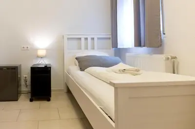 Ein Bett oder Betten in einem Zimmer der Unterkunft Hotel Frankenthaler Hof