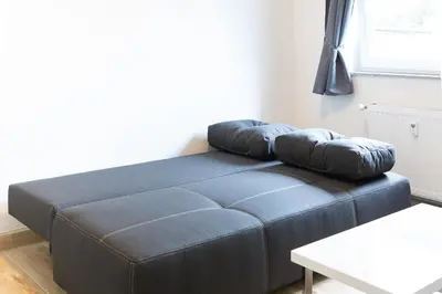 Ein Bett oder Betten in einem Zimmer der Unterkunft Holidayapartment Rüsselsheim