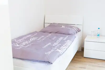 Ein Bett oder Betten in einem Zimmer der Unterkunft Holidayapartment Rüsselsheim