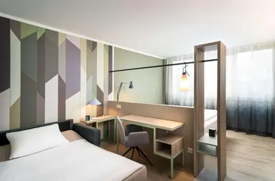 Ein Bett oder Betten in einem Zimmer der Unterkunft elaya hotel stuttgart ludwigsburg, Trademark by Wyndham