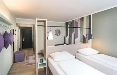 Ein Bett oder Betten in einem Zimmer der Unterkunft elaya hotel stuttgart ludwigsburg, Trademark by Wyndham