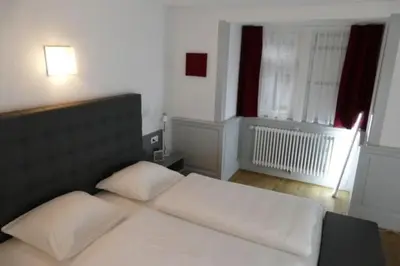 Ein Bett oder Betten in einem Zimmer der Unterkunft Hotel Ottheinrich