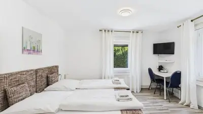 Ein Bett oder Betten in einem Zimmer der Unterkunft City Hotel