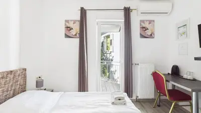 Ein Bett oder Betten in einem Zimmer der Unterkunft City Hotel