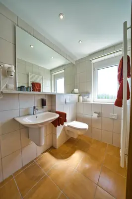 Ein Badezimmer in der Unterkunft Hotel Tenner
