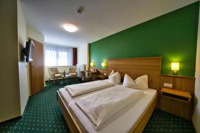 Ein Bett oder Betten in einem Zimmer der Unterkunft Hotel Tenner