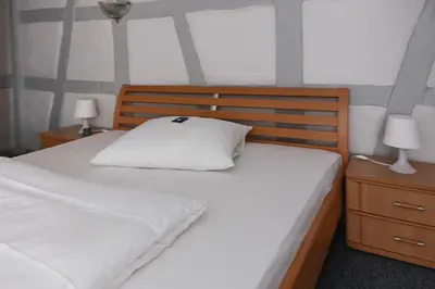 Ein Bett oder Betten in einem Zimmer der Unterkunft Hotel Haus Landgraf