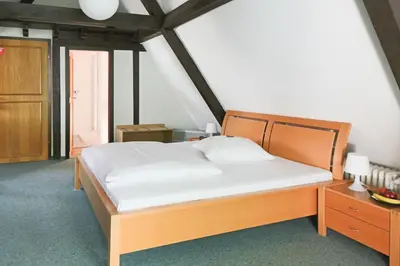 Ein Bett oder Betten in einem Zimmer der Unterkunft Doernersches Haus