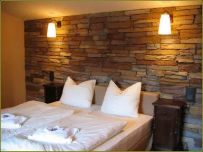 Ein Bett oder Betten in einem Zimmer der Unterkunft Hotel Villa Boddin