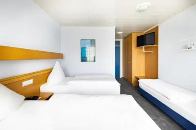 Ein Bett oder Betten in einem Zimmer der Unterkunft Hotel ISG Heidelberg