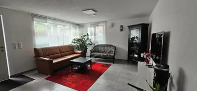 Ein Sitzbereich in der Unterkunft Ferienwohnung Buchberg Exklusiv