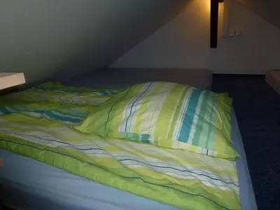Ein Bett oder Betten in einem Zimmer der Unterkunft Ferienhaus im Nordschwarzwald