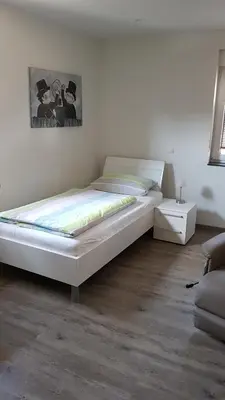 Ein Bett oder Betten in einem Zimmer der Unterkunft Boardinghouse Waldbronn