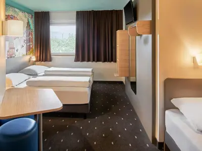 Ein Bett oder Betten in einem Zimmer der Unterkunft B&B Hotel Darmstadt