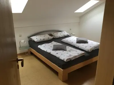 Ein Bett oder Betten in einem Zimmer der Unterkunft Haus am Waldrand