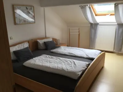 Ein Bett oder Betten in einem Zimmer der Unterkunft Haus am Waldrand