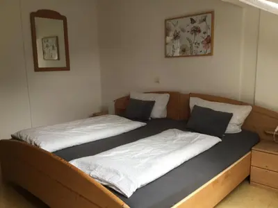 Ein Bett oder Betten in einem Zimmer der Unterkunft Haus am Waldrand