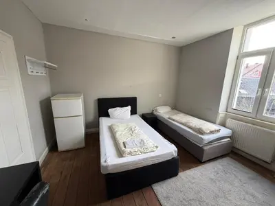Ein Bett oder Betten in einem Zimmer der Unterkunft Zimmer in Kaiserslautern