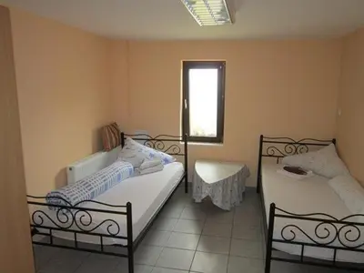 Ein Bett oder Betten in einem Zimmer der Unterkunft Gasthof und Pension Mainzer Rad