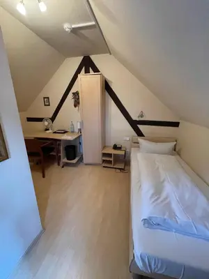 Ein Bett oder Betten in einem Zimmer der Unterkunft Landhotel Sickinger Hof
